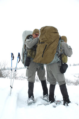 US_Navy_090406-N-6224W-025_A_SEAL_Qualification_Training_candidate_checks_the_gear_of_another_member_of_his_squad_during_a_long-range_land_navigation_exercise.jpg