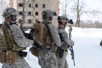 Germany, Special Forces Soldiers exit a building after clearing it. This is rehearsal for a night reconnaissance training mission Feb. 15 2010.jpg